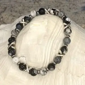 Armband JaXX/Cross black & white uitgevoerd met edelstaal.