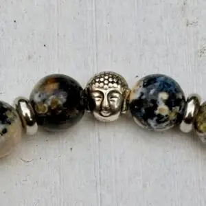 a bracelet with a buddha on it