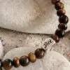 Tiger's eye bracelet on pebbles