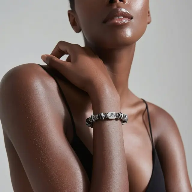 Model showcasing a stylish bracelet in black and white